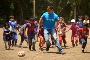 On 1 June 2016, UNICEF goodwill ambassador Ricky Martin plays football with Syrian refugee children at Al-Hissa informal refugee settlement in northern Lebanon. World-renowned singer and UNICEF Goodwill Ambassador Ricky Martin calls for increased focus on safeguarding the futures of millions of children affected by the Syria conflict, whose lives have been shaped by displacement, violence and a persistent lack of opportunities. During the two-day visit to Lebanon from 1-2 June 2016, Martin also witnessed how UNICEF is working to provide protective environments for children and adolescents where they can play and receive the support they need to get back into formal education. In Lebanons Bekaa valley and Akkar, Martin participated in recreational activities for children at safe spaces in informal settlements. Additionally, he met adolescents attending life-skills training, provided by UNICEF and partners, where girls and boys are given vocational training and learning support. Around 1.1 million Syrians have sought refuge in Lebanon since the start of the crisis in 2011, more than half of them are children. Child refugees are particularly at risk of exploitation and abuse, with large numbers being left with no choice but to go out to work, rather than attend school. Child refugees are particularly at risk of exploitation and abuse, with large numbers being left with no choice but to go out to work, rather than attend school. The deteriorating economic situation for Syrian refugees has dramatically exacerbated the problem of child labour in Lebanon. Adding to the psychological distress already affecting many of the children who have fled conflict and violence at home is the challenge associated with some of the worst forms child labour such as working on construction sites, which can cause long-term developmental and psychological damage as well as physical harm. UNICEF is working closely with the Government institutions, as well as local and international part