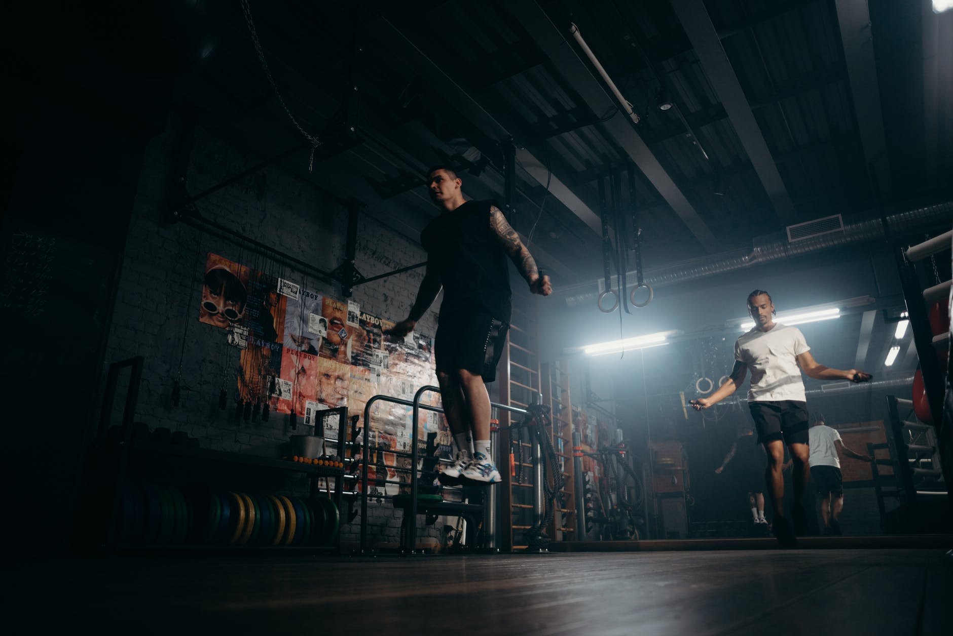 man in black t shirt and black pants playing skateboard